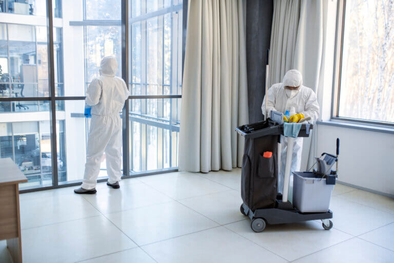 full shot people hazmat suit cleaning